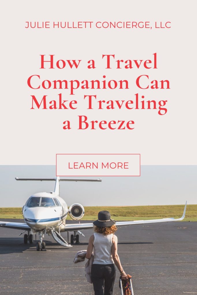 How a Travel Companion can make traveling a breeze with a photo of Julie Hullett walking toward a plane while wheeling a suitcase.